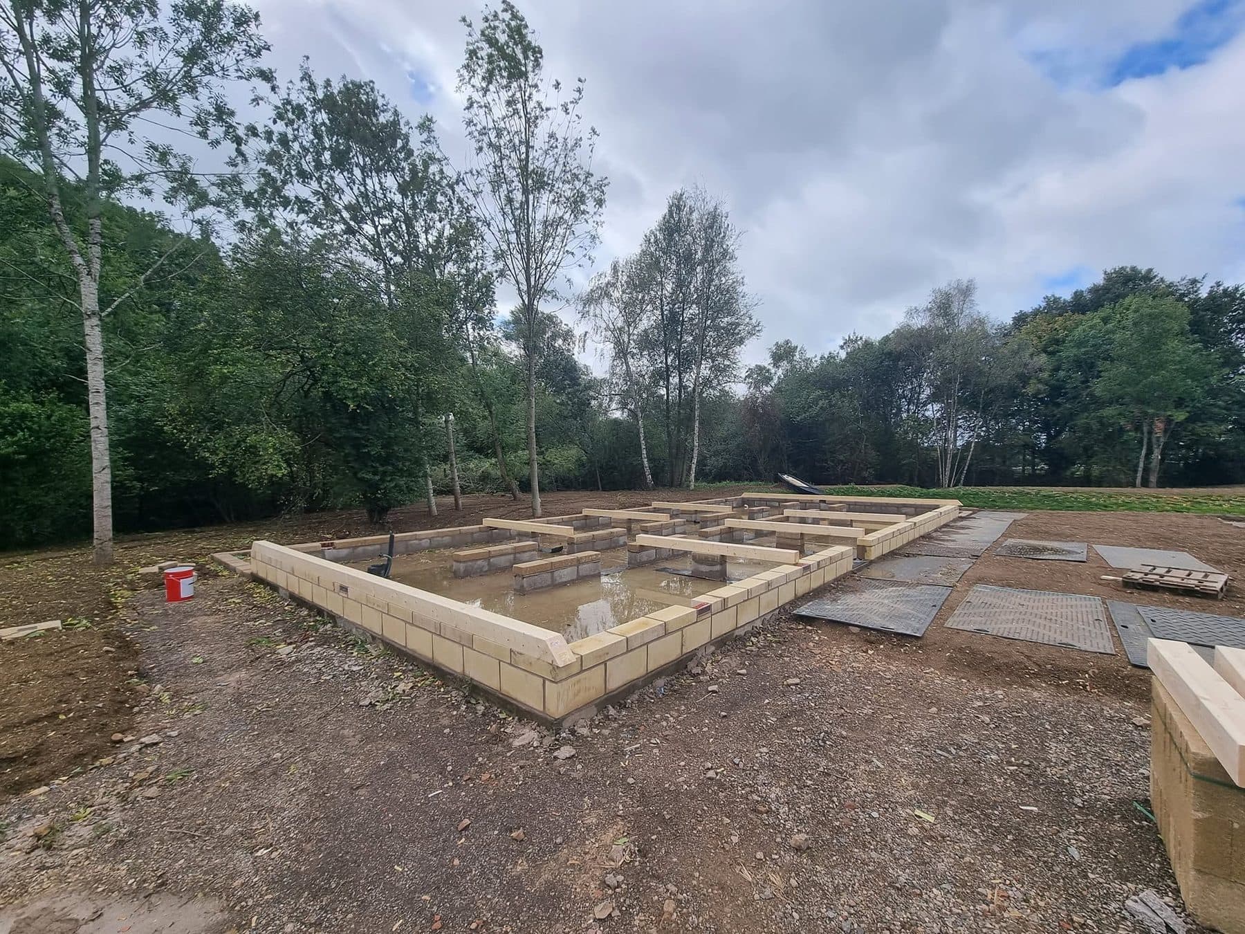 Blockwork base for a timber building: perimeter walls with timber wall plates and internal sleeper walls